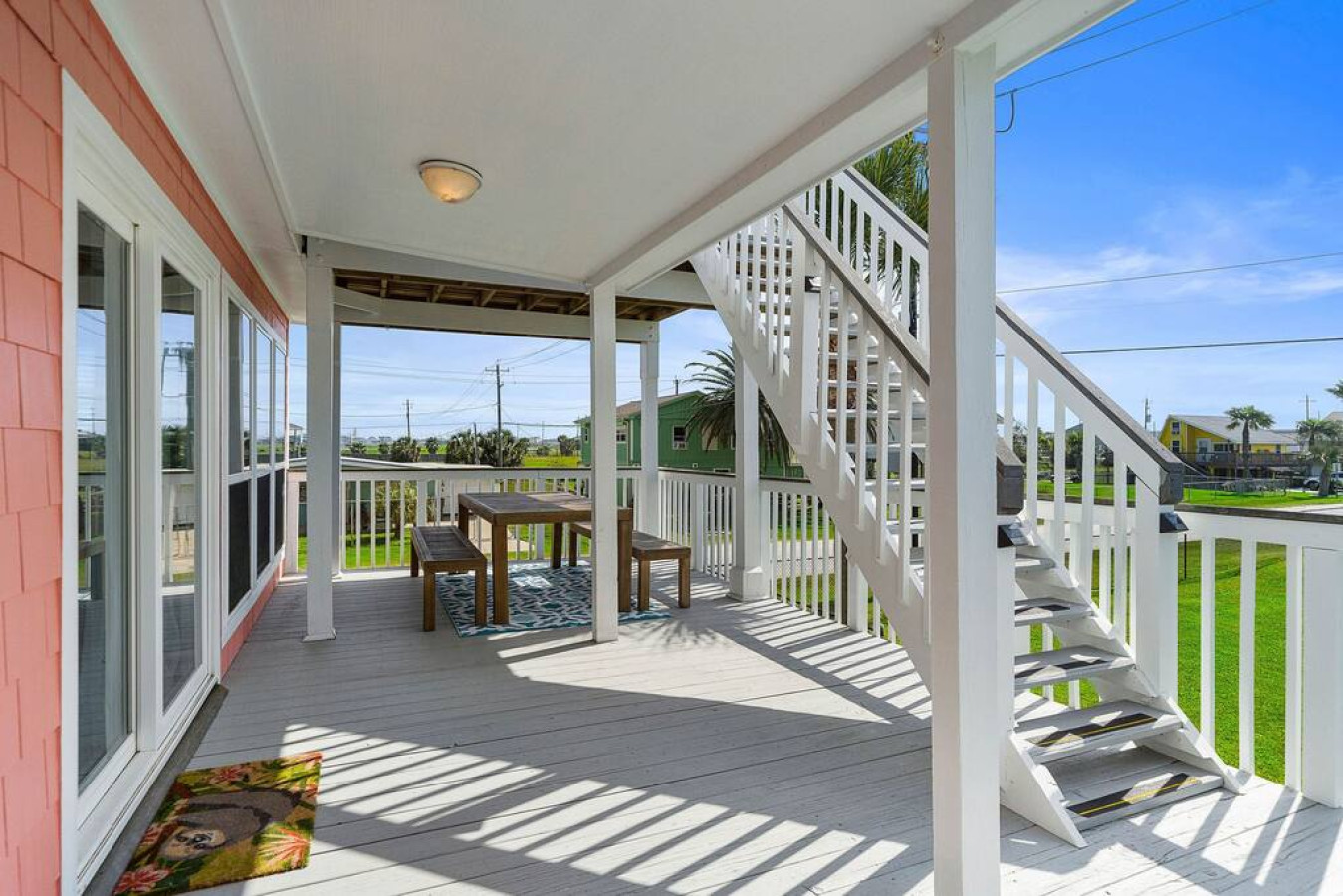Sun bathed deck on the main floor with great dining space