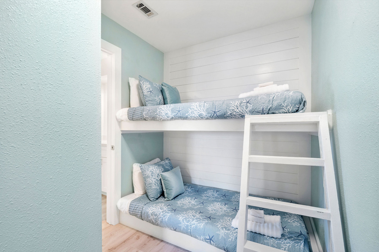 This bedroom has a double-deck twin bed