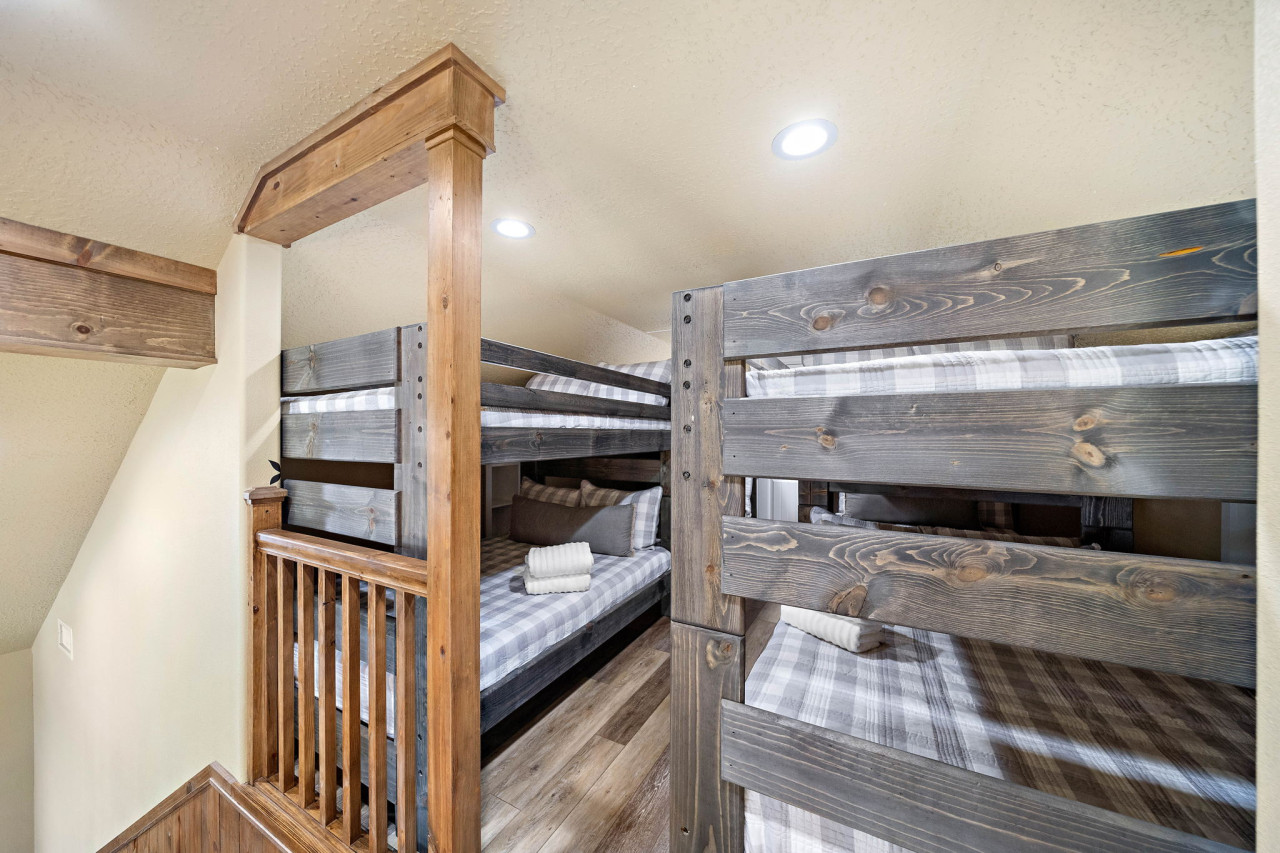 This bedroom has 2 full bunk beds