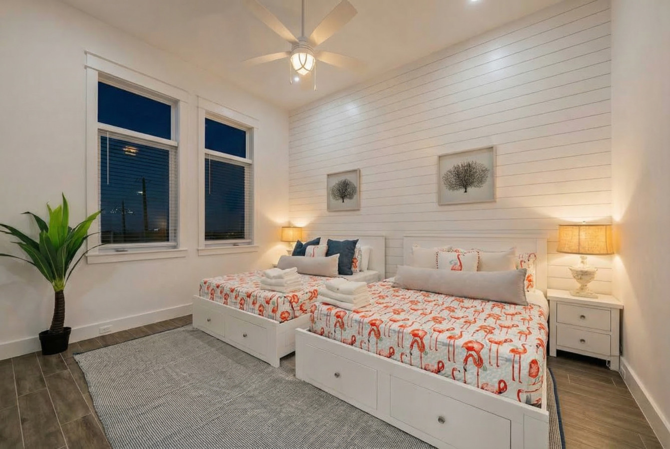 This bedroom has 2 queen beds