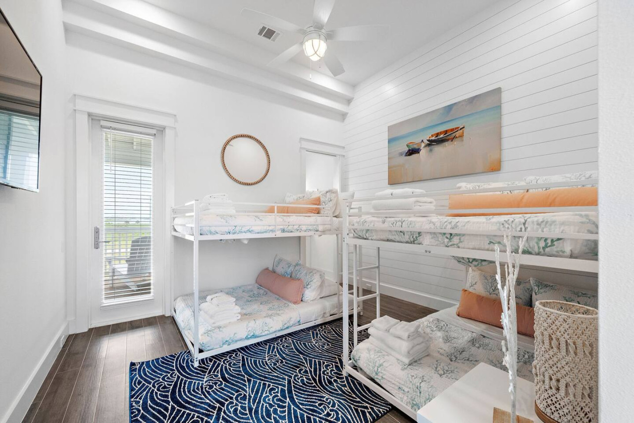 This bedroom has 2 full over full bunk beds