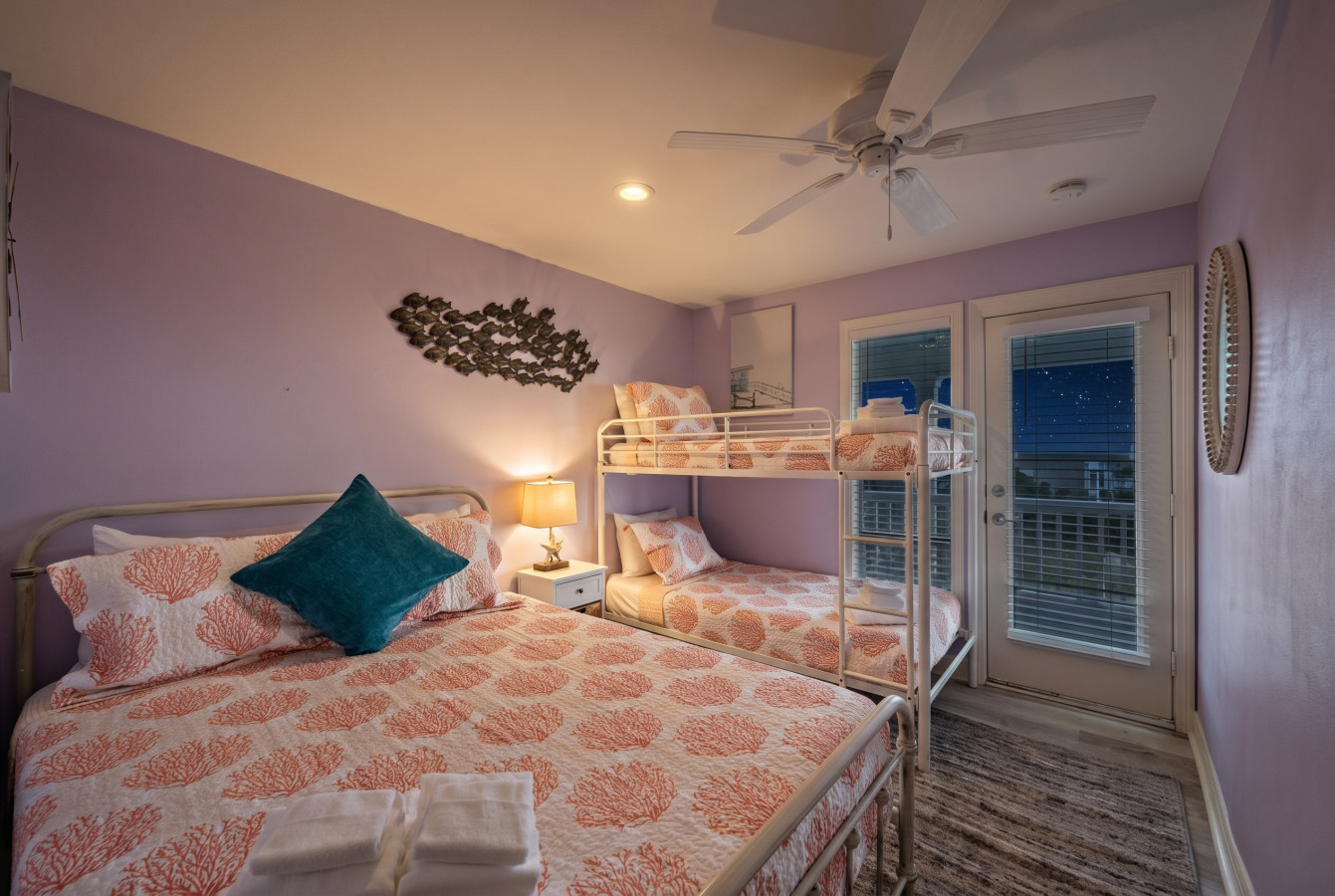 Drift into a peaceful sleep surrounded by the luxury of 1 Queen and 2 Double beds in this inviting bedroom
