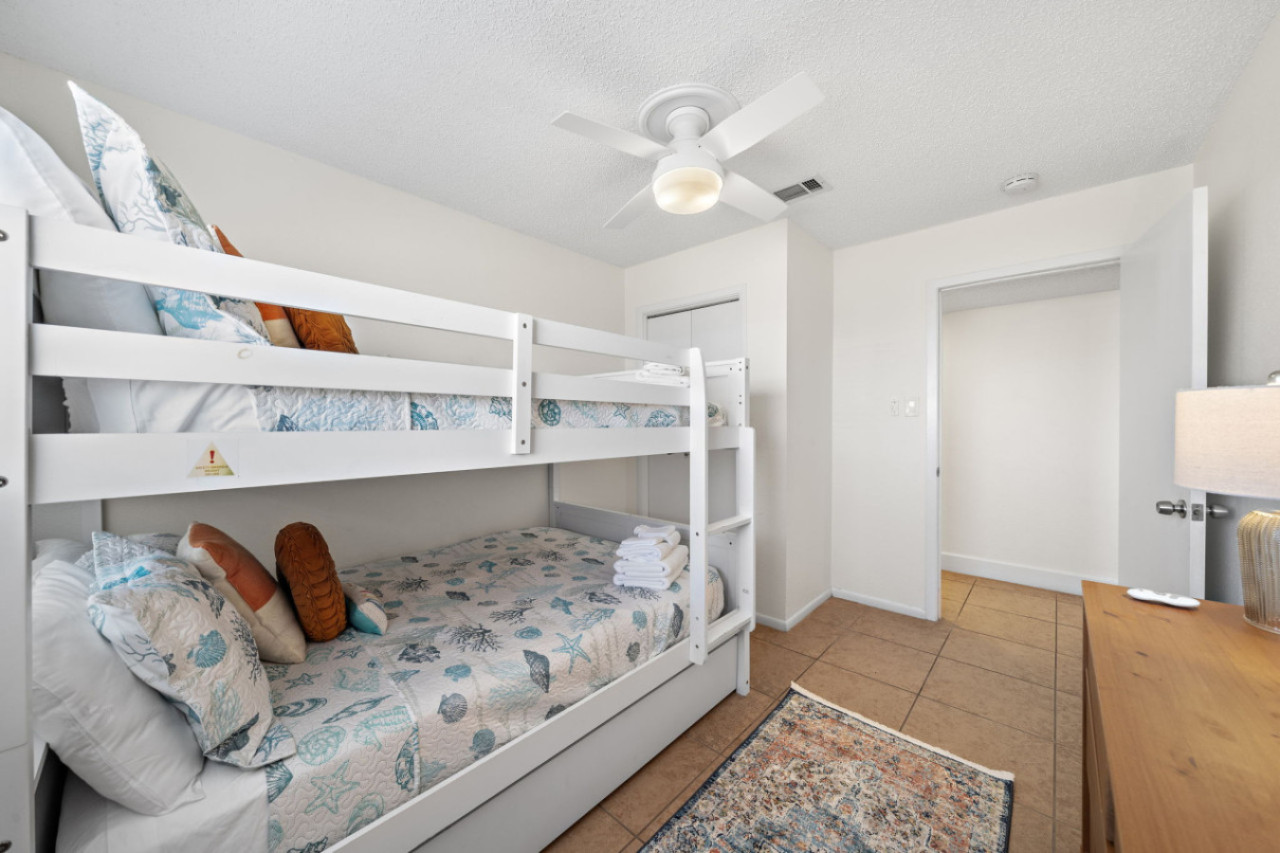 Soothing ambiance and well-planned details define this bedroom oasis with this double-sized bunk bed
