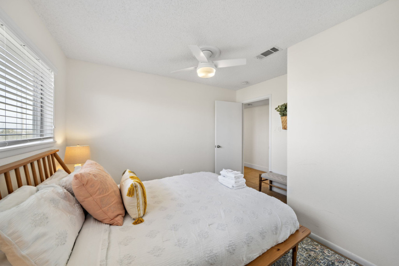 A symphony of design tailored for relaxation with this queen-sized bed