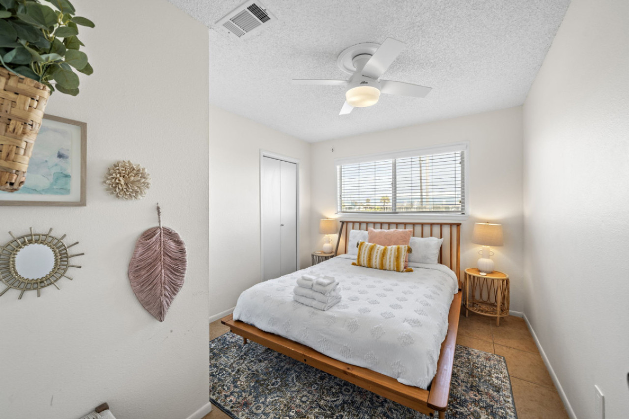 Navigate the layout of bedroom serenity with this queen-sized bed