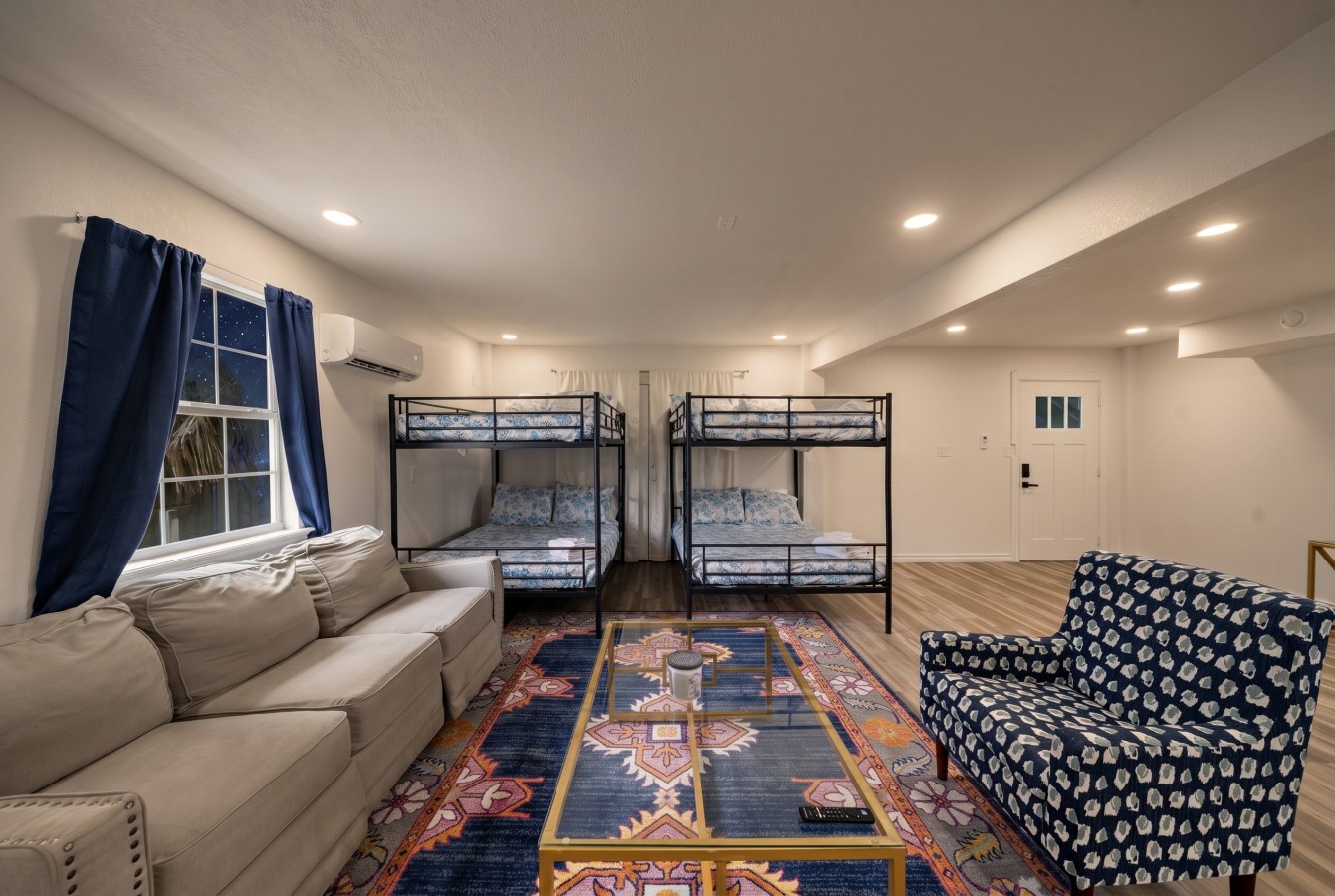 There are two queen-over-queen bunk beds in this room