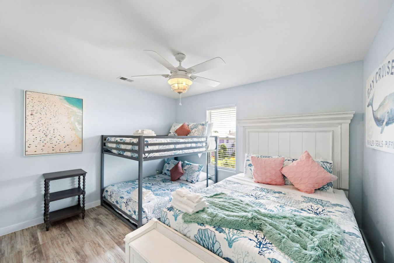 This bedroom has 1 Queen and a double bunk bed
