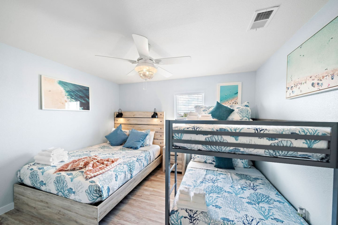 This bedroom has 1 Queen and a double bunk bed