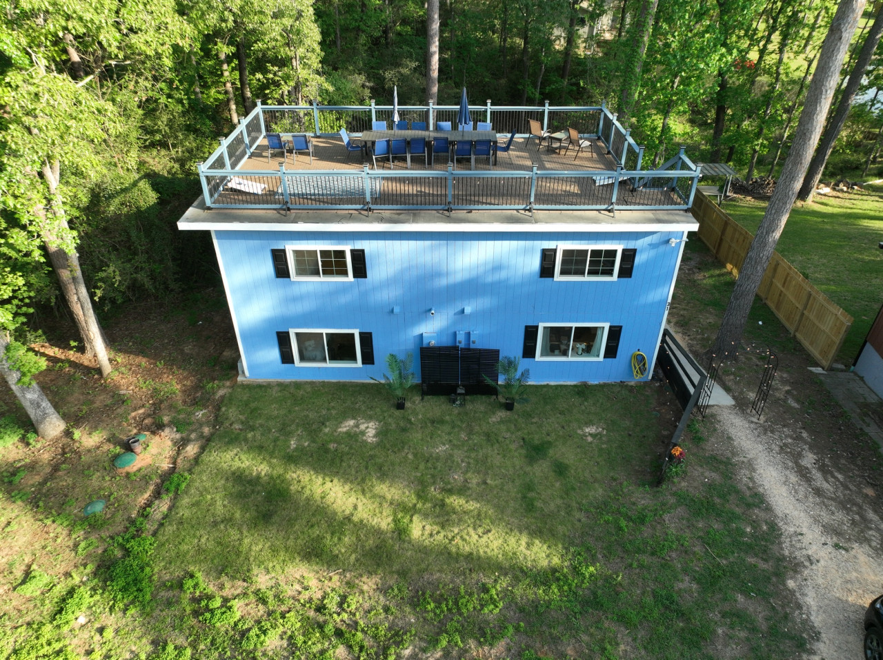 The large yard and semi-shaded rooftop deck