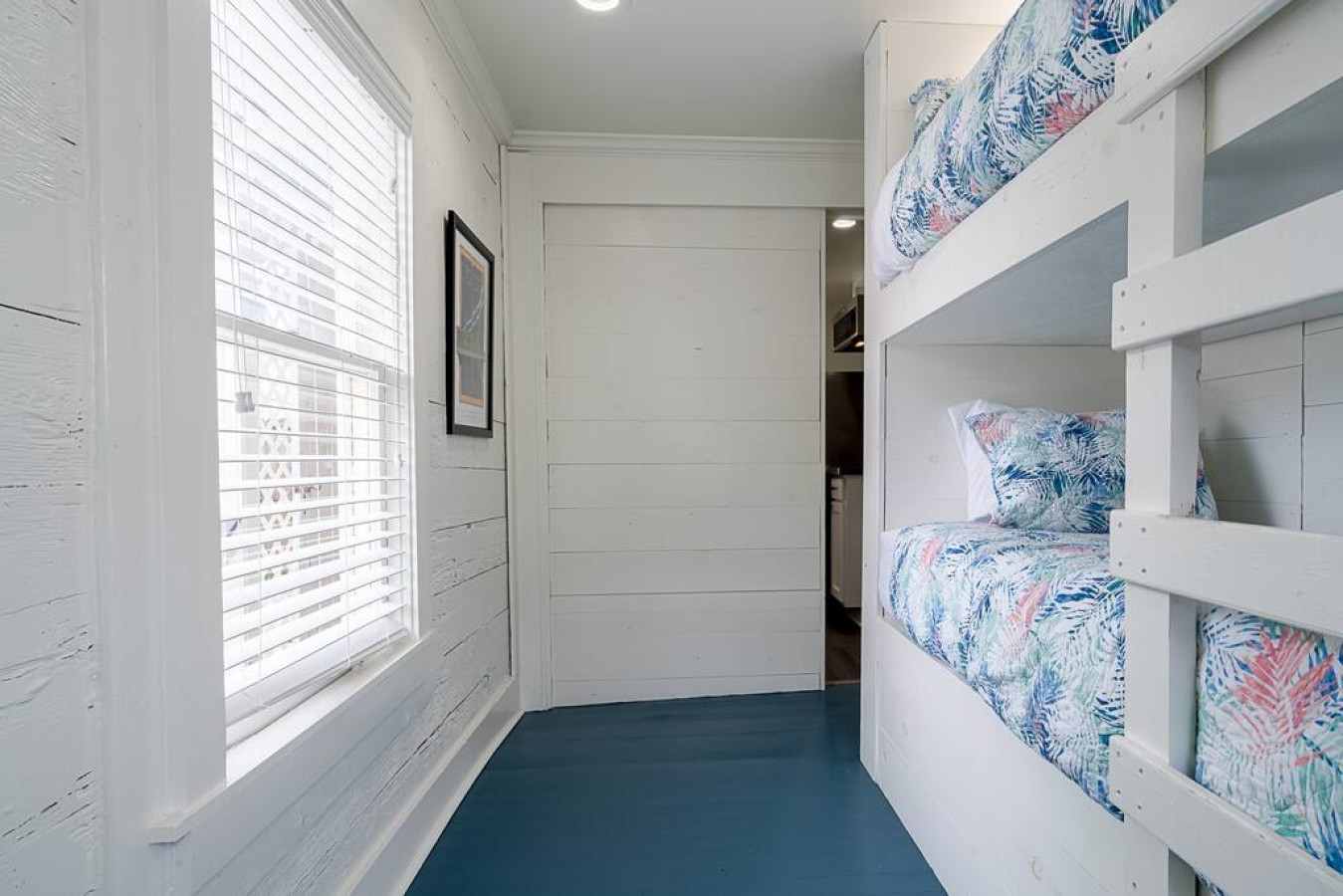 This bedroom has twin bunk beds