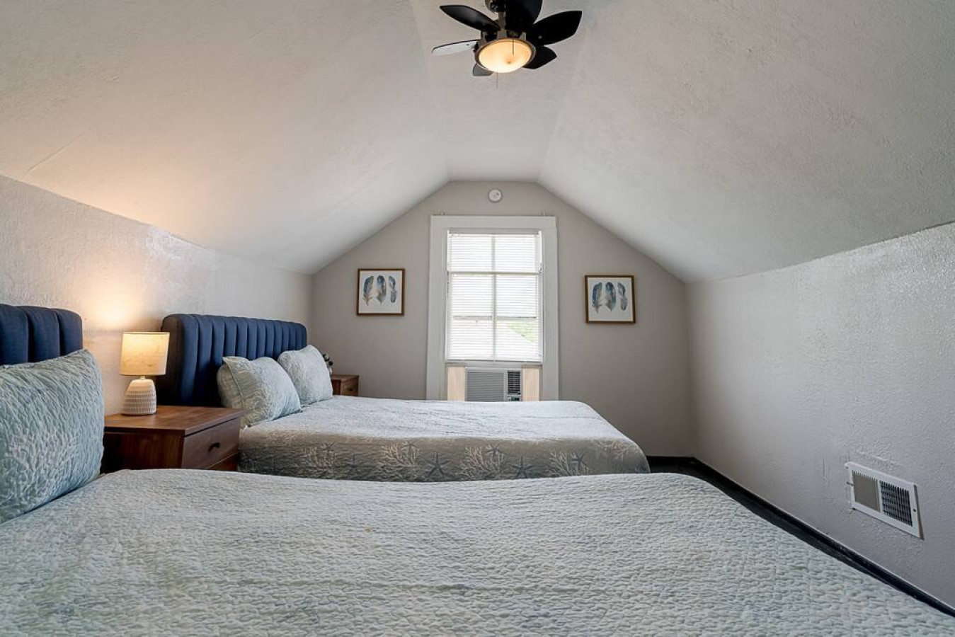 This bedroom has 2 full sized beds