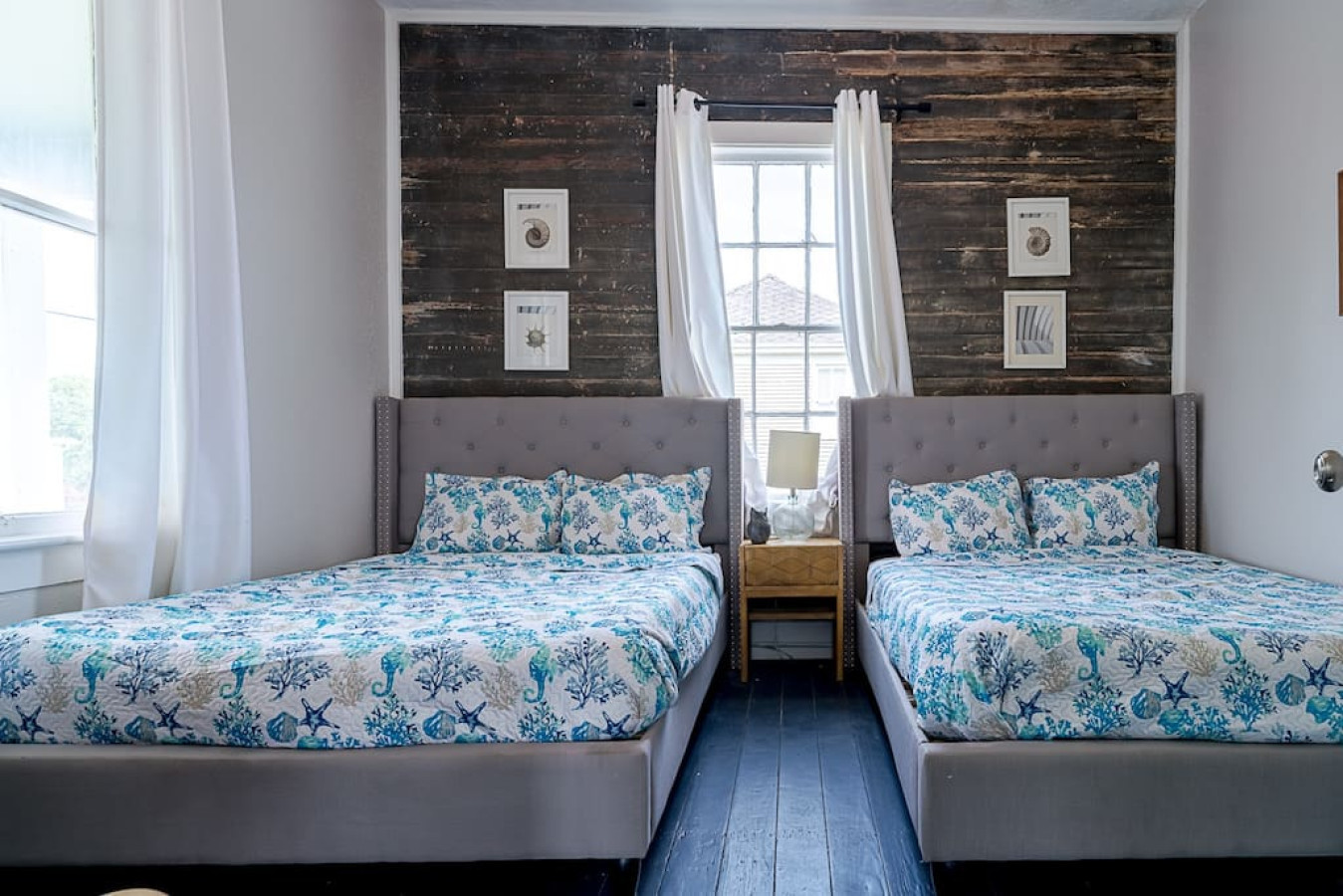 This bedroom has 2 queen sized beds