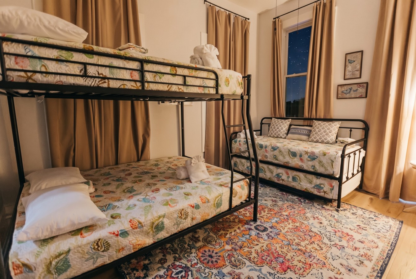 This bedroom has a Twin Trundle Bed and a Twin Bunk Bed