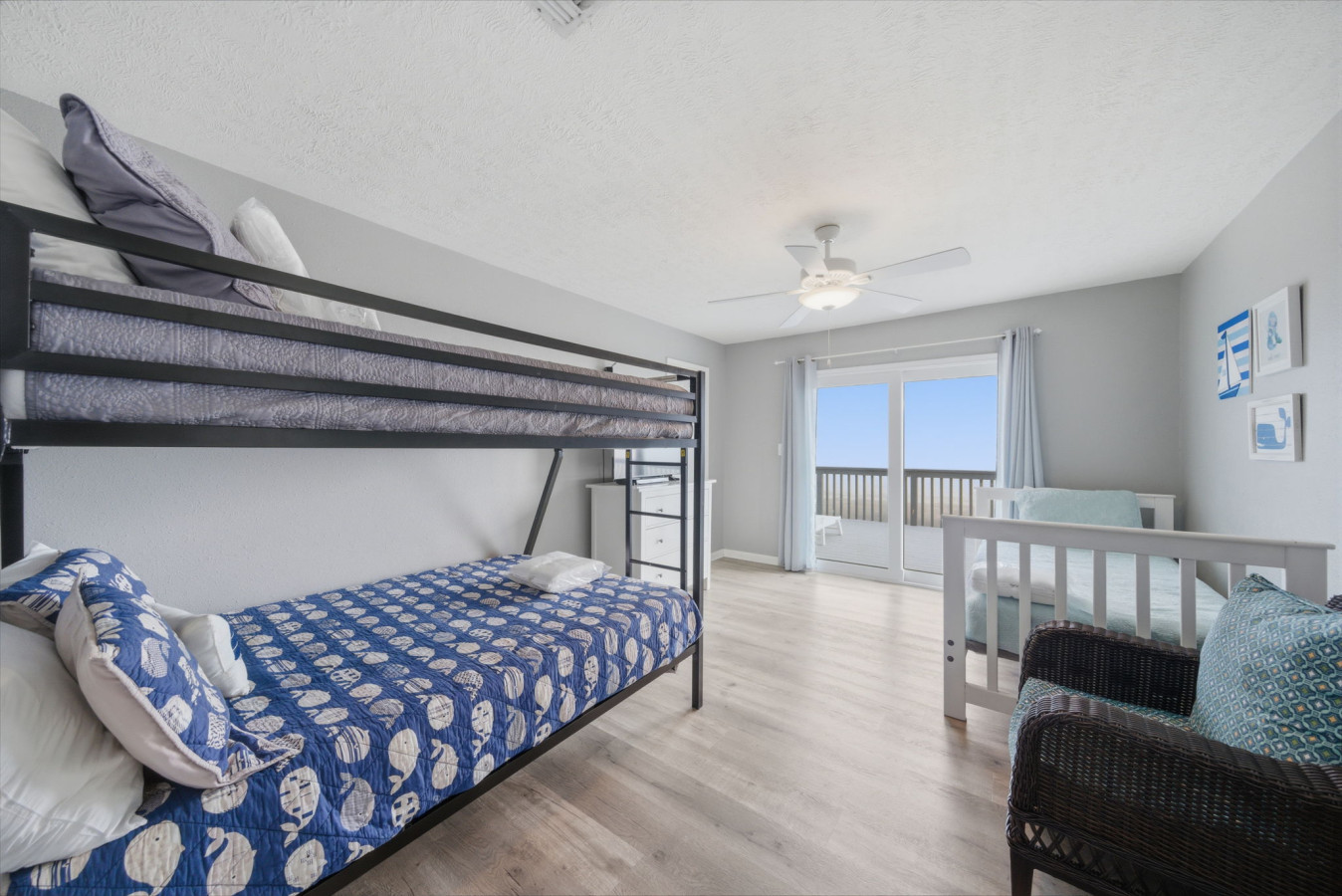 This bedroom has a twin over twin bunk bed & day bed