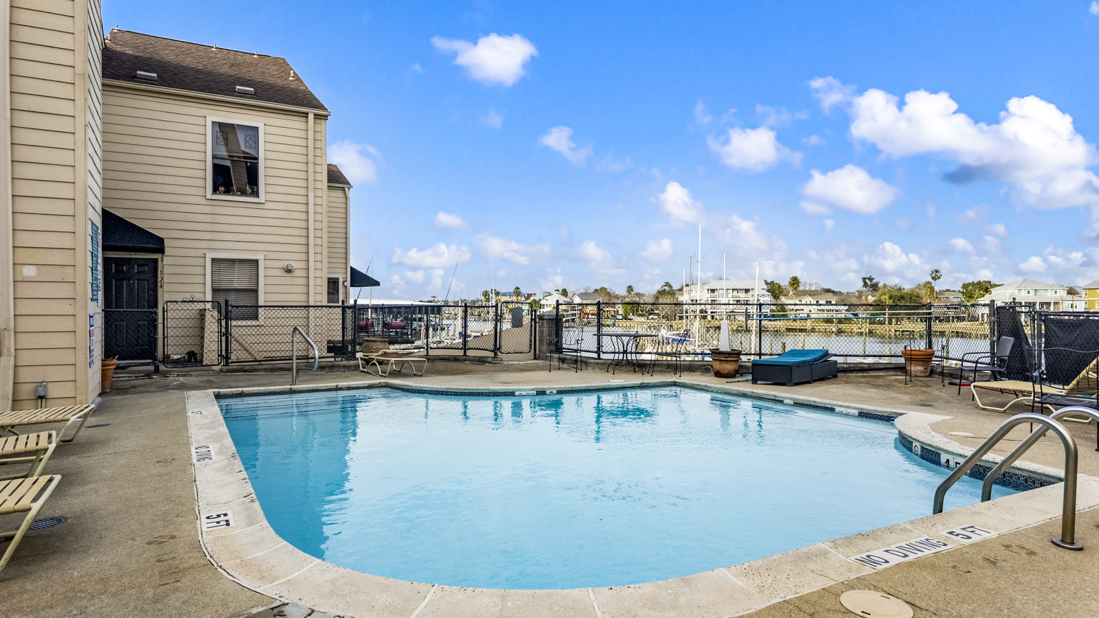 Refreshing pool area overlooking the marina
