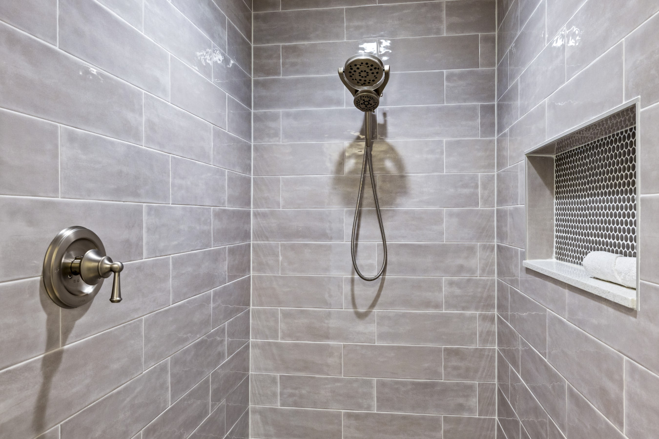 Modern walk-in shower with sleek tilework