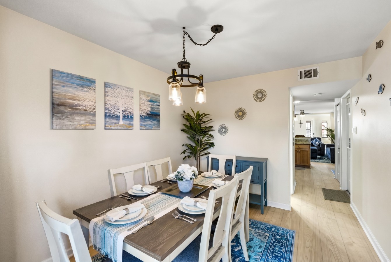 Sun-filled dining area with coastal décor