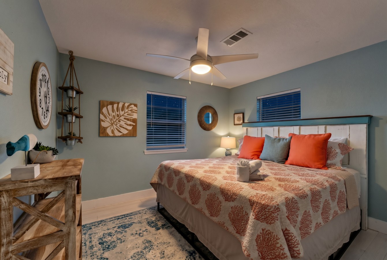 A guest bedroom on the main floor has a king-size bed