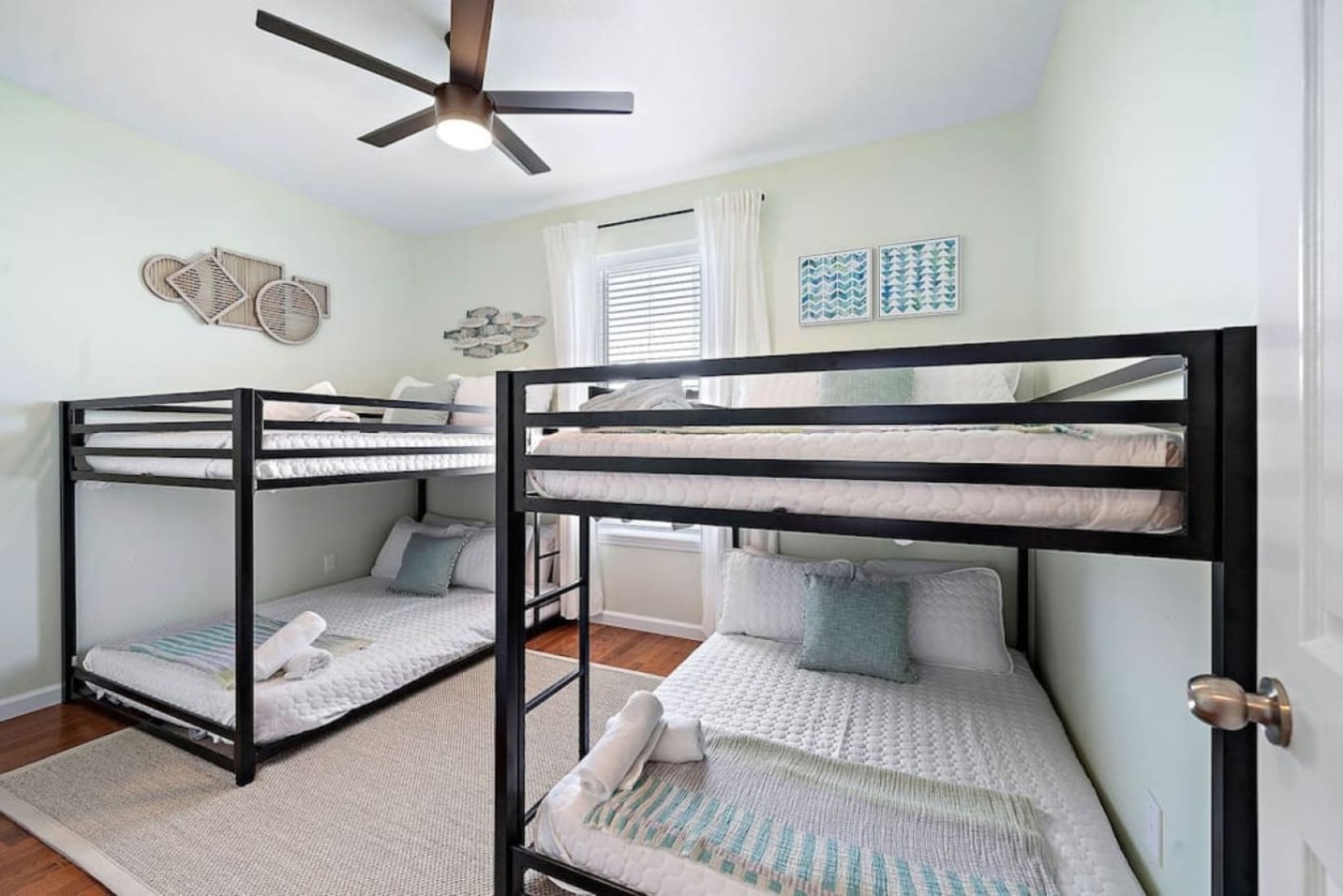 A bunk room on the third floor has two full-over-full size bunk beds