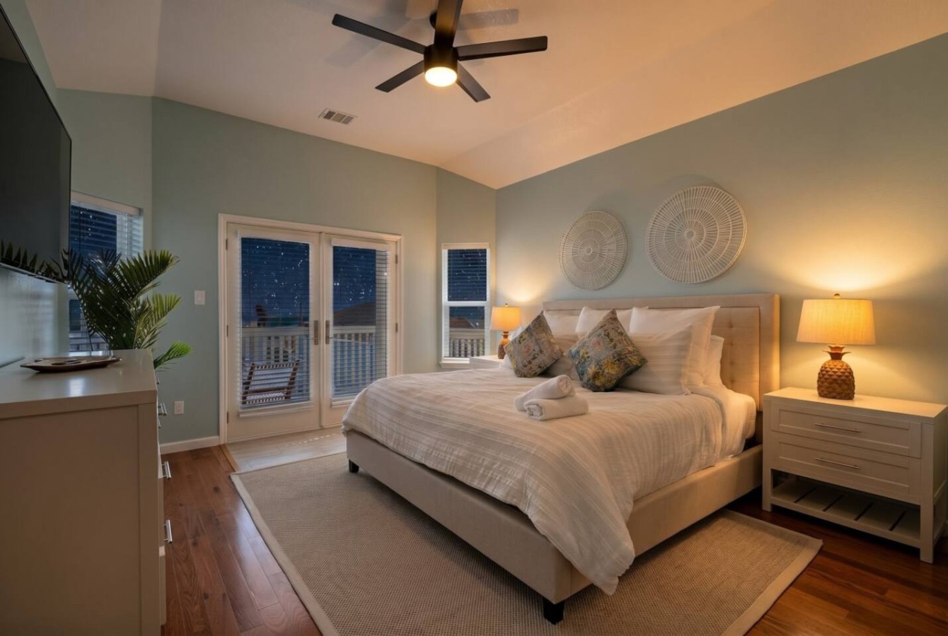 The master bedroom on the third-floor is stunning— with a private balcony