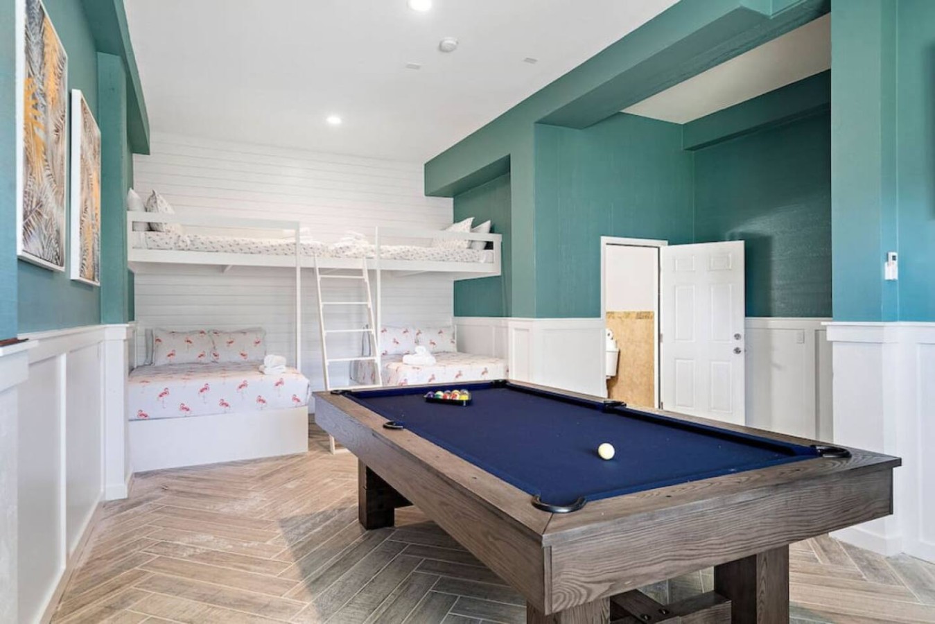 The game room/bedroom on the ground level is massive— and has a pool table!