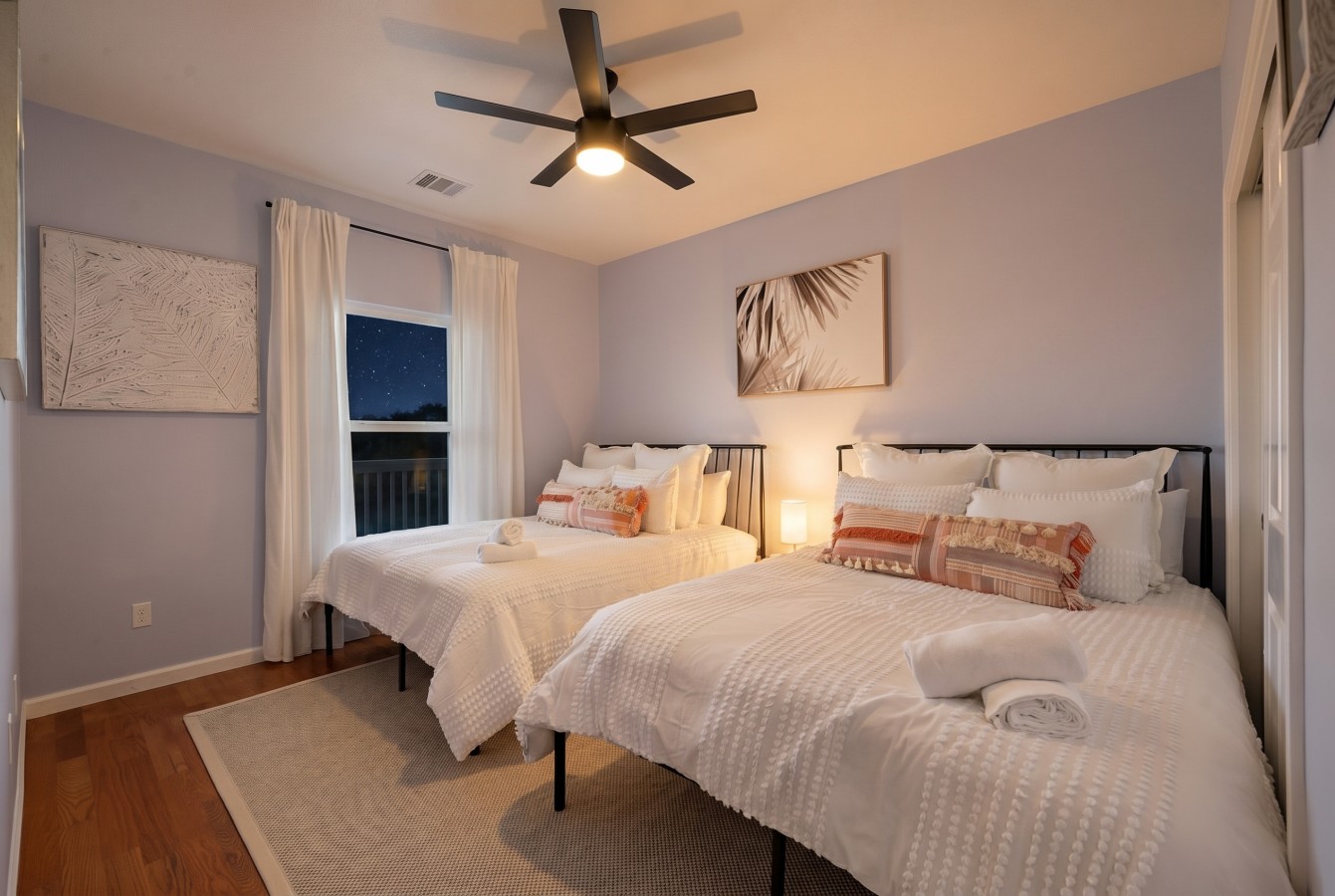 Another guest room on the main level has two queen-size beds