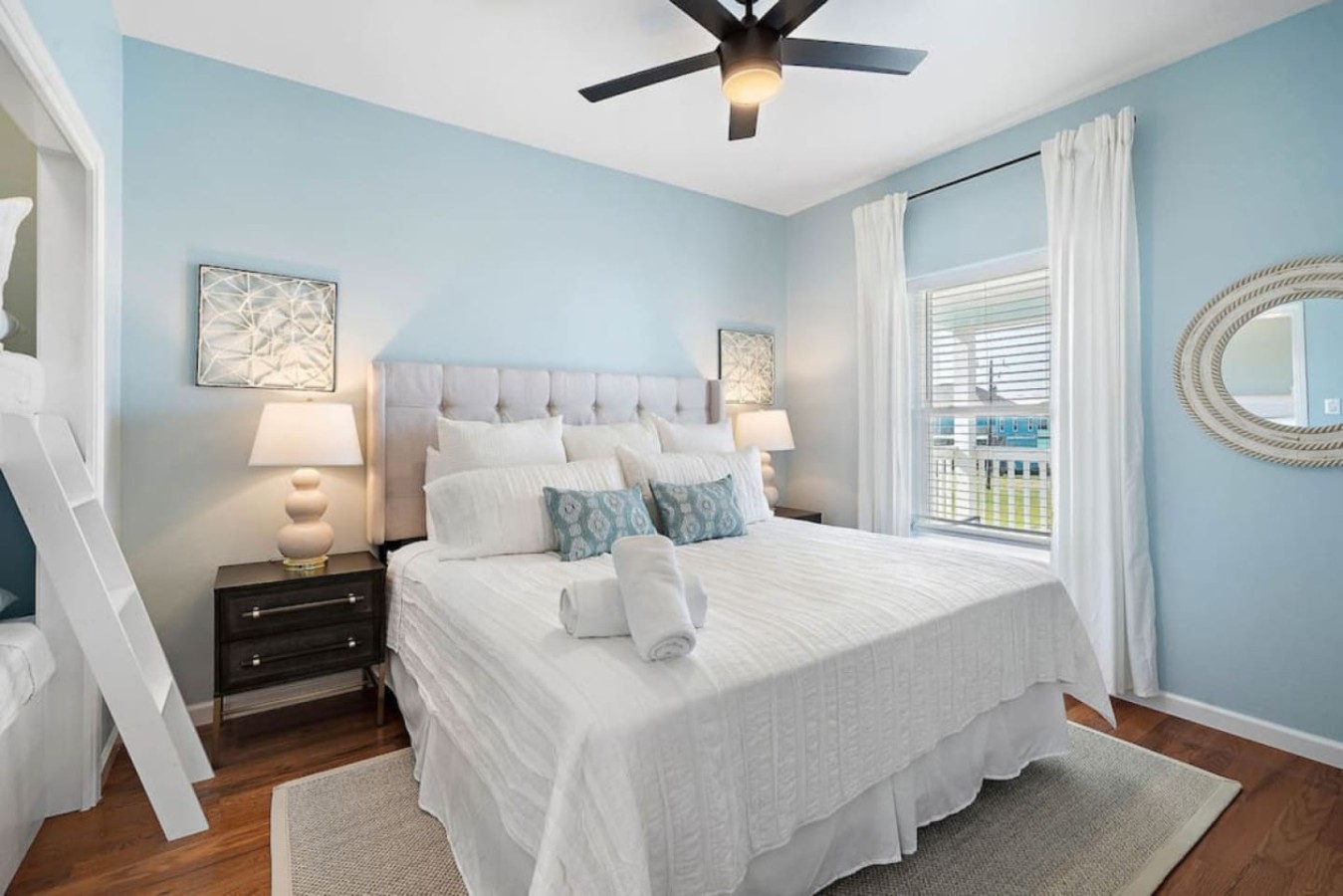 This bedroom on the main level has a king-size bed and a twin-over-twin bunk