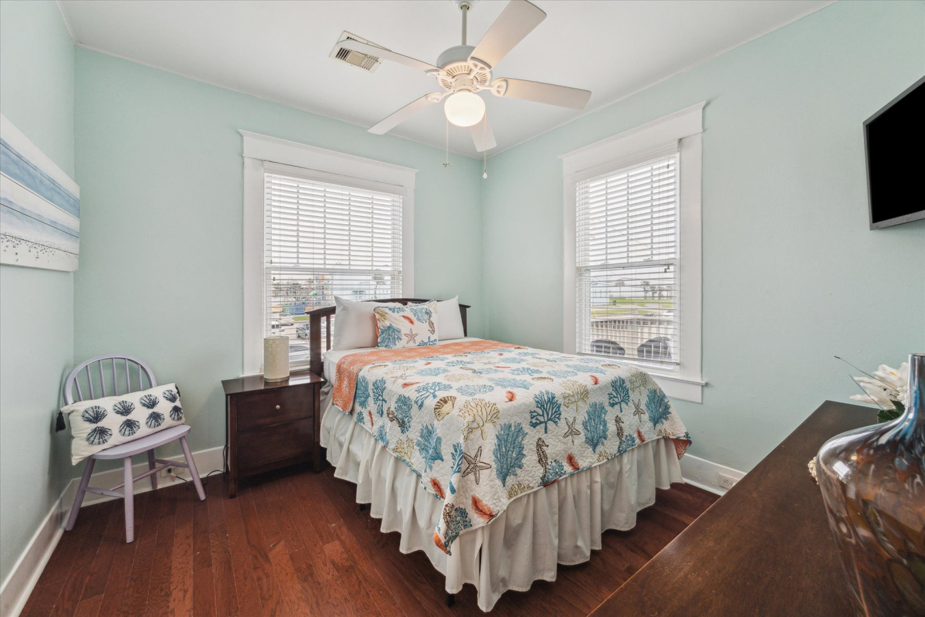 Relax and recharge in this inviting queen bedroom