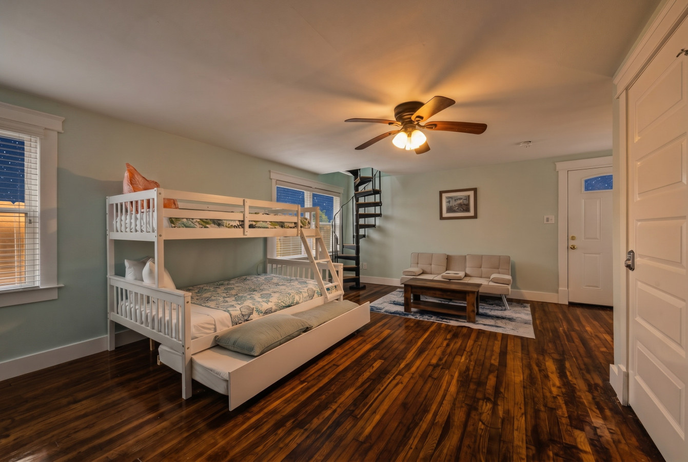 This bedroom has a twin over full bunk bed with a trundle