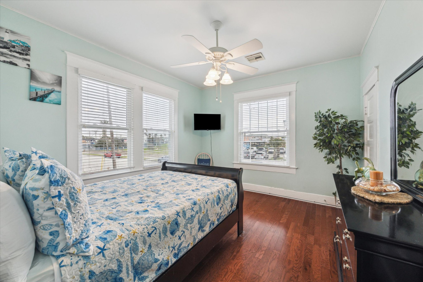 This bedroom features a comfortable full-sized bed