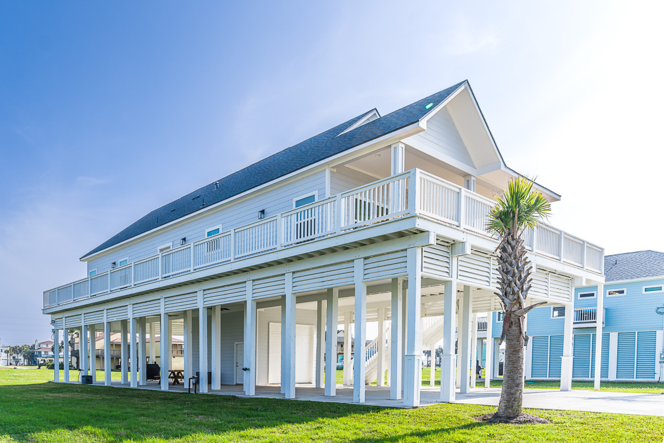 Experience island living in this spacious and elegantly constructed beach home
