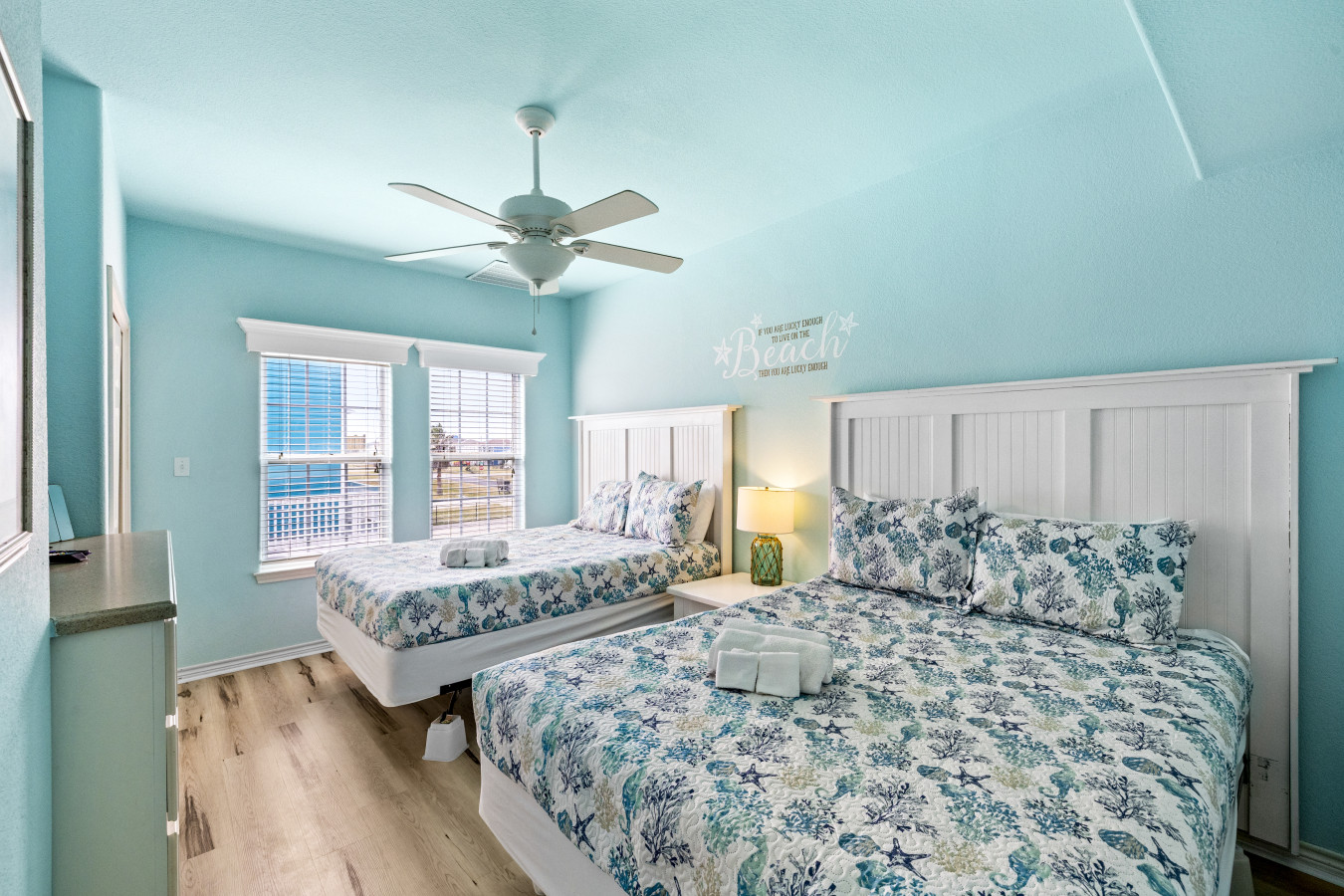 This bedroom has 2 queen beds
