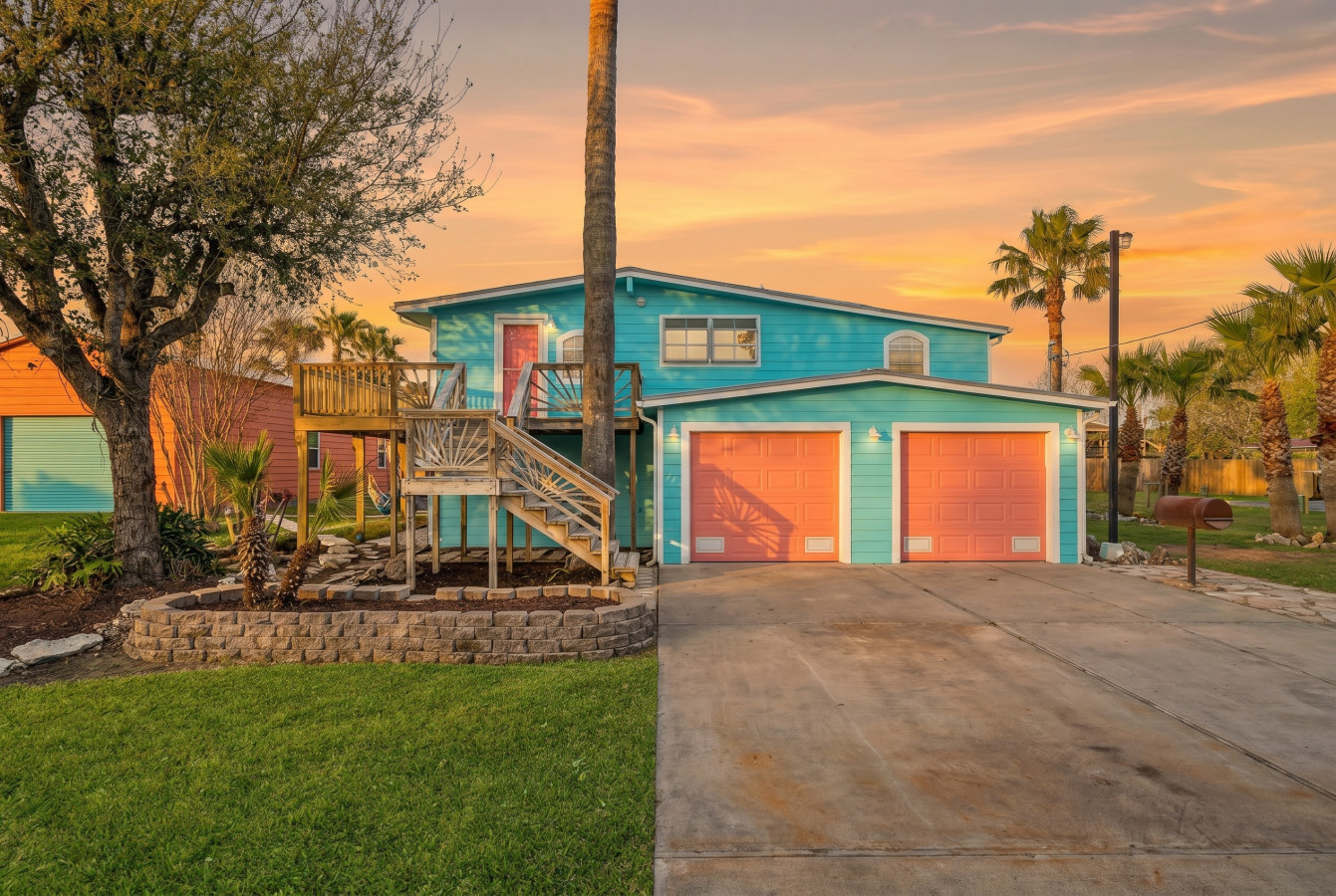 Frontal perspective of the house and more parking spaces in the driveway