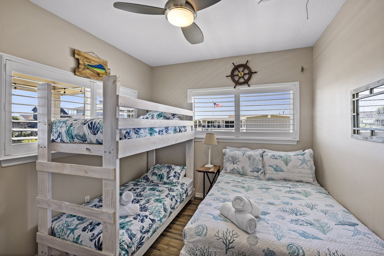 This bedroom has a full bed and a twin/twin bunk bed