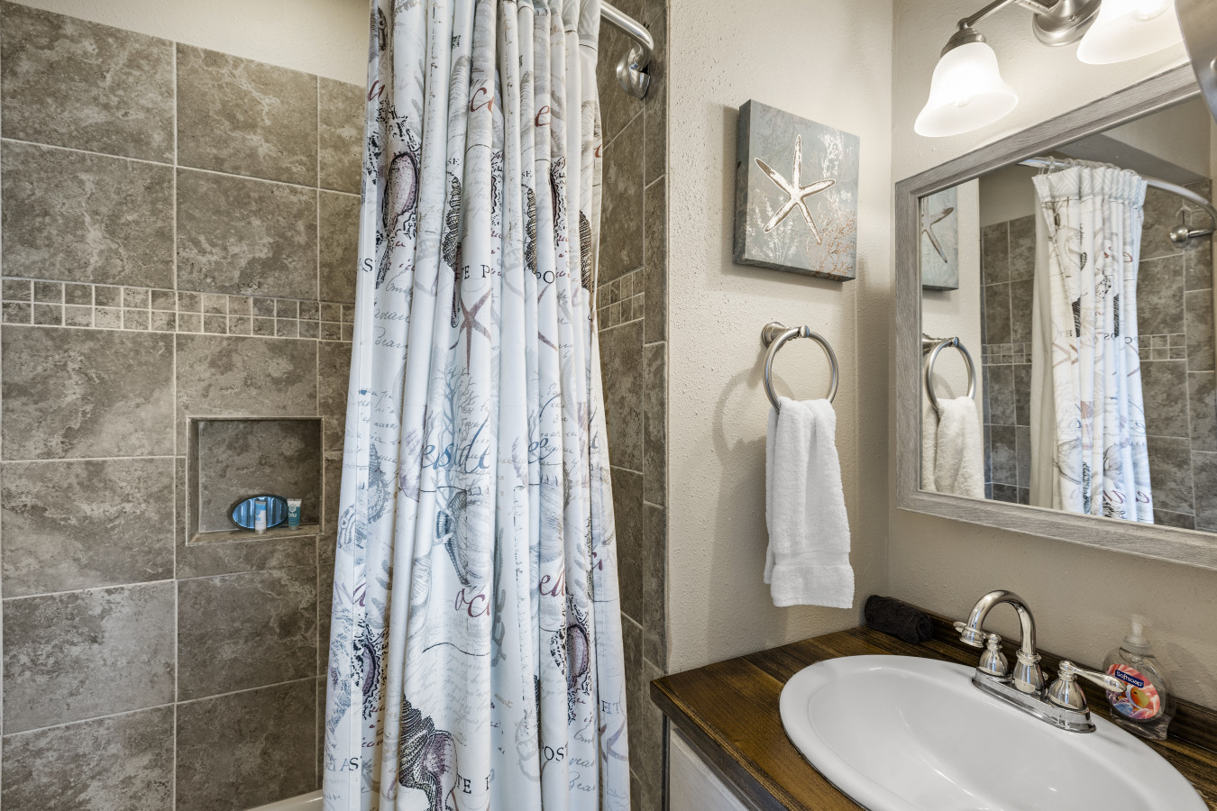 A well-appointed bathroom with a tiled walk-in shower