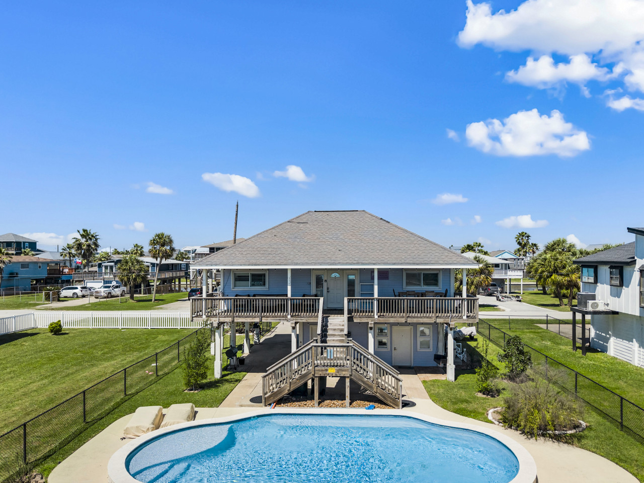 Beautiful coastal retreat featuring pool, deck, and canal access