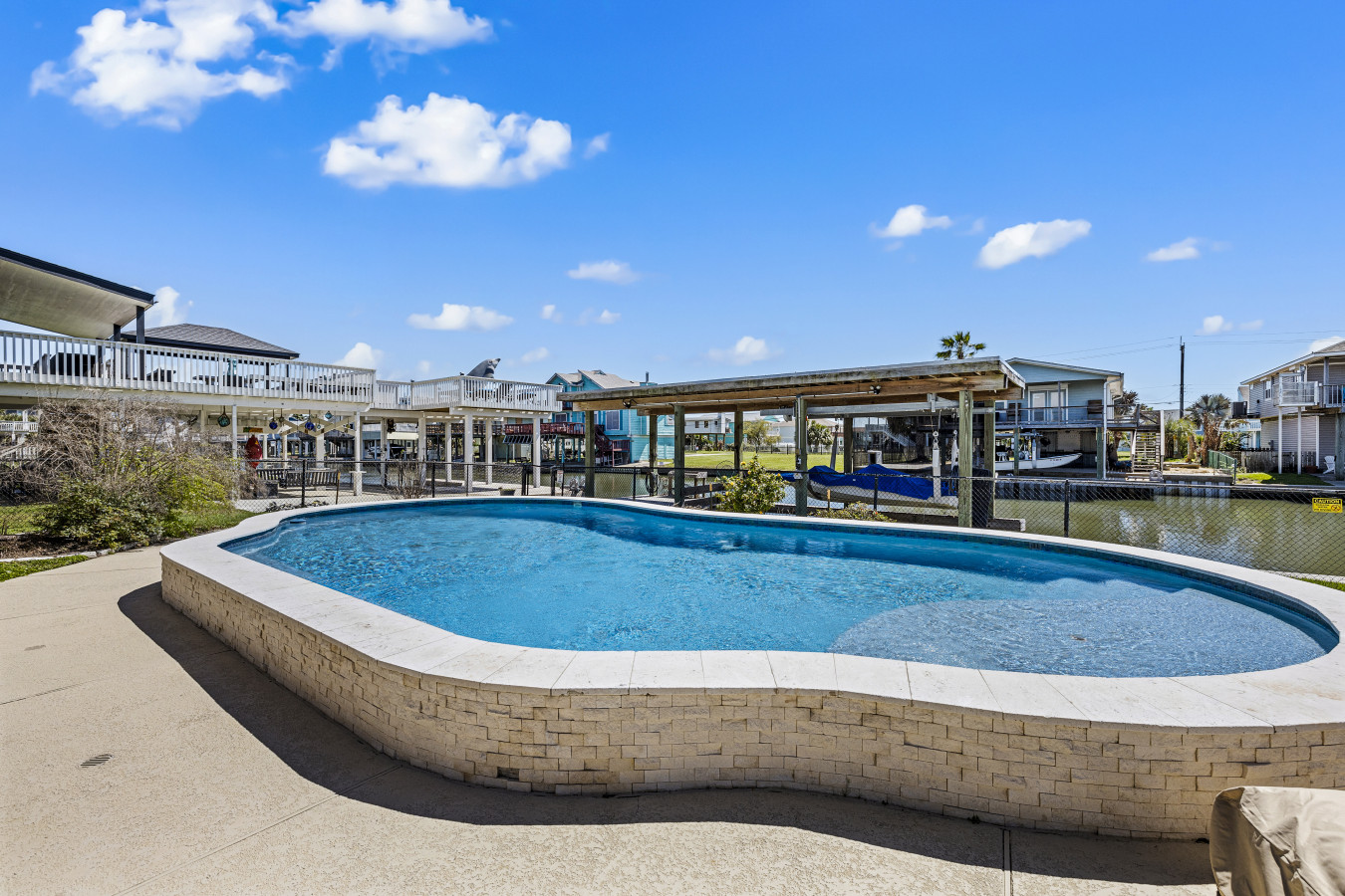 Relax and unwind by the beautiful waterfront pool