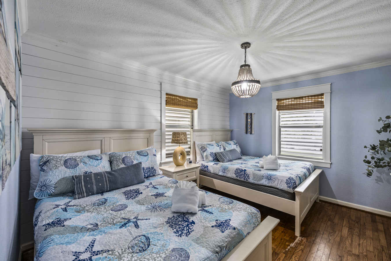 This bedroom has 2 queen sized beds
