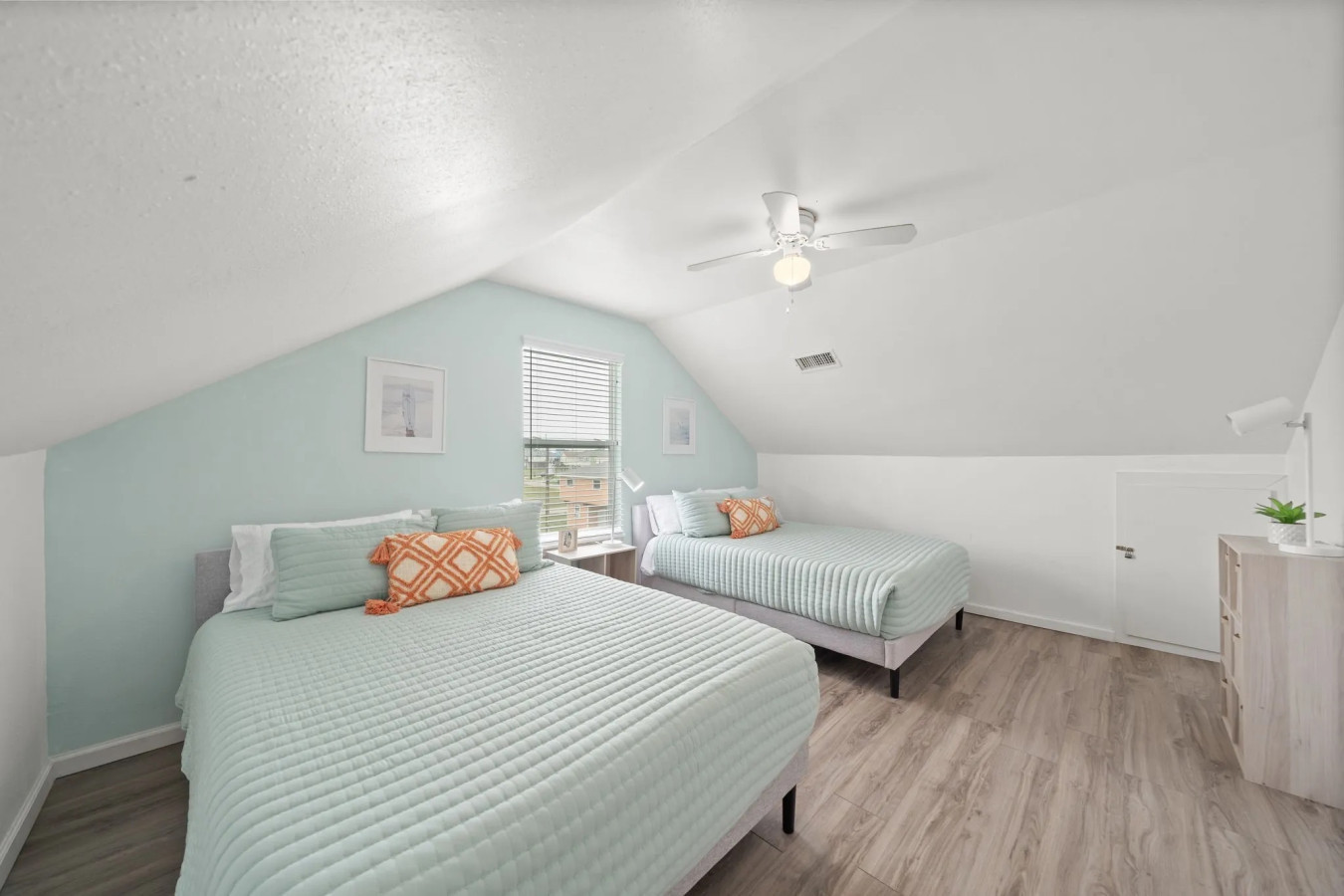 This bedroom has 2 queen beds