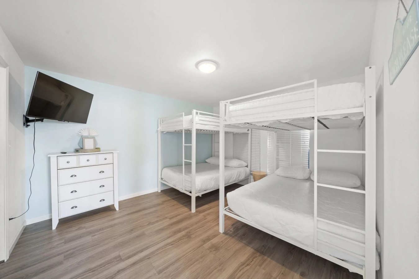 This bedroom has 2 queen-over-queen bunks