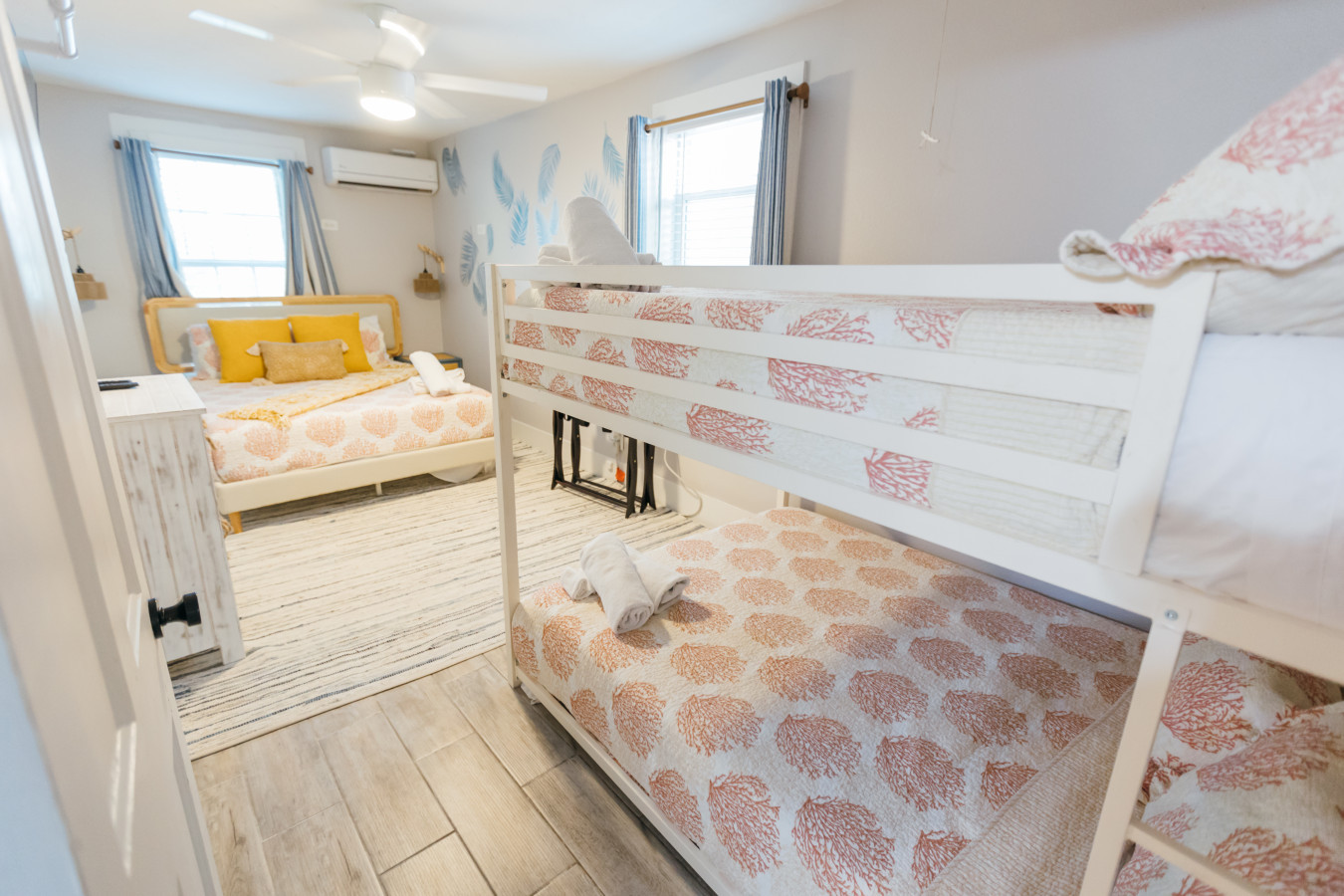 This bedroom has a queen bed and a full-over-full bunk