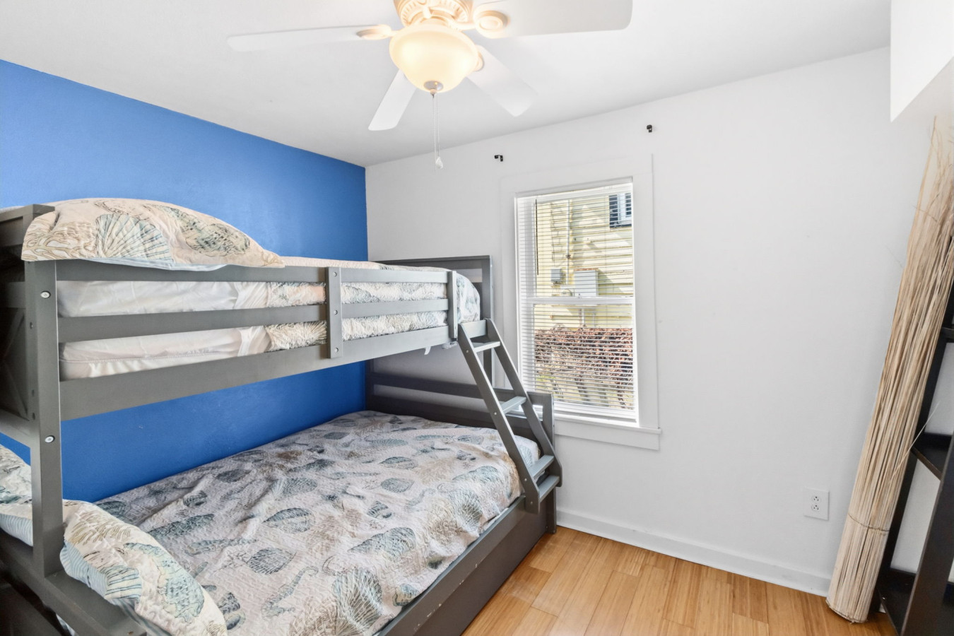 This bedroom has a twin over full bunk bed