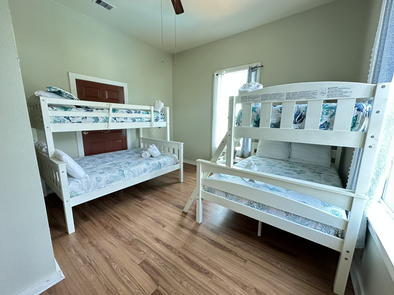 This bedroom has two twin over full bunk beds