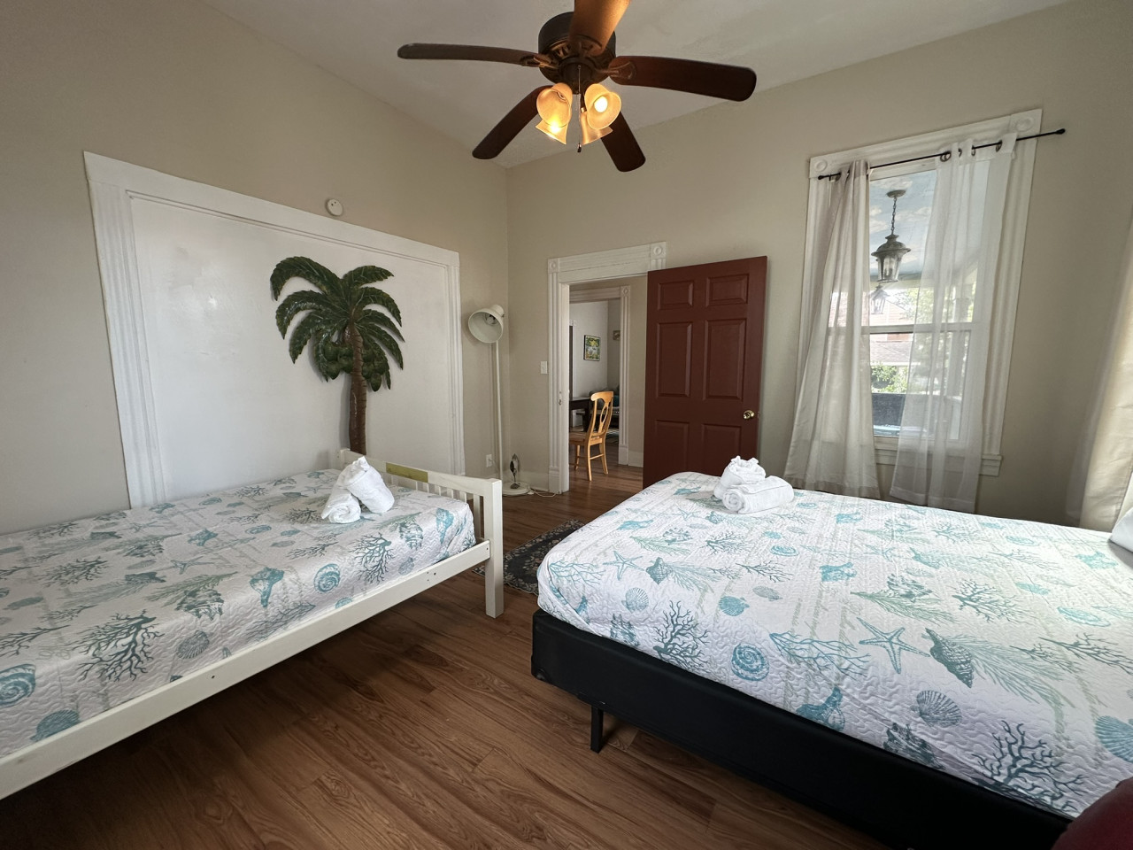 This bedroom has a queen bed and a full bed
