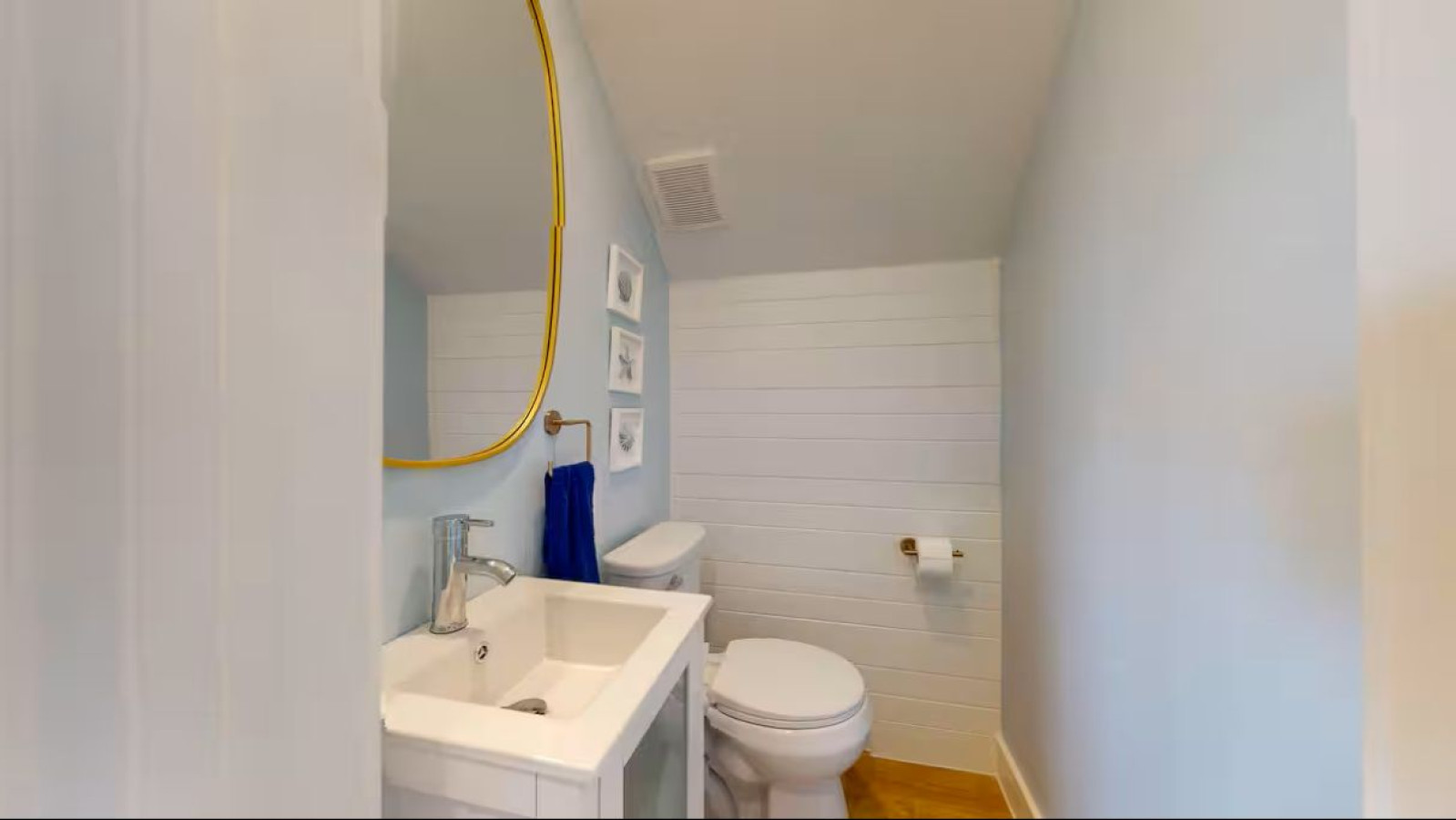 Clean and bright powder room for added convenience