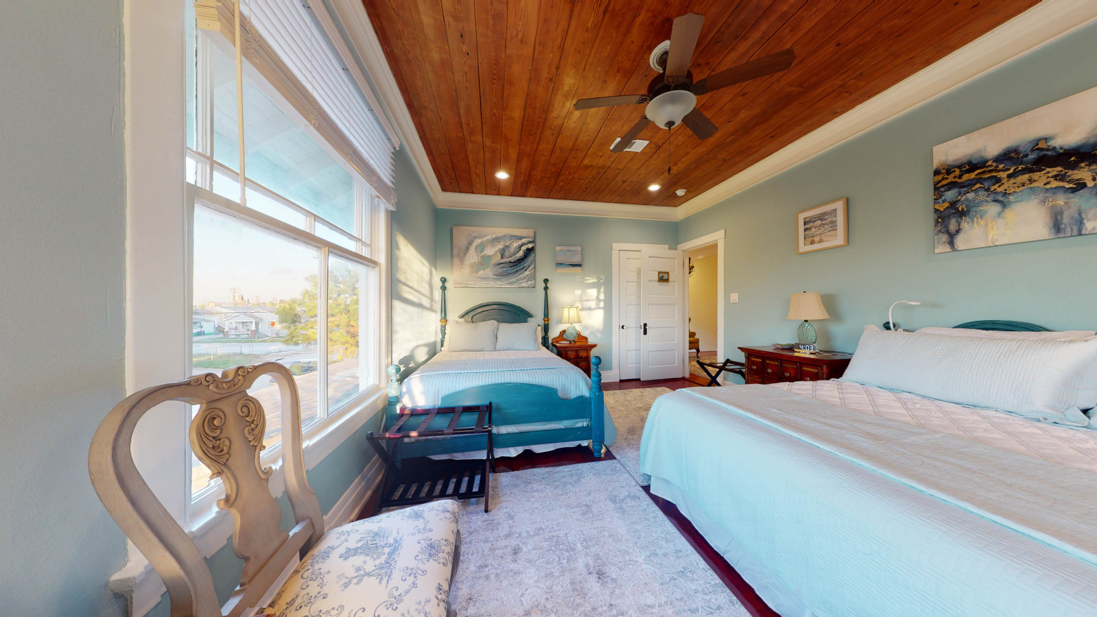 This bedroom has a king bed and a queen bed
