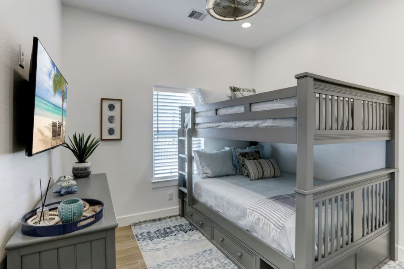 This bedroom has a queen over queen bunk bed