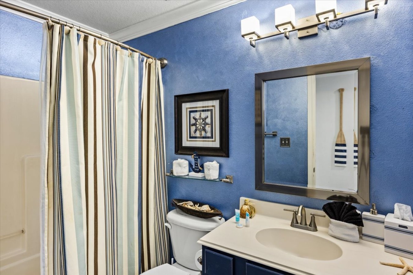 Refresh & rejuvenate in this bright coastal bathroom