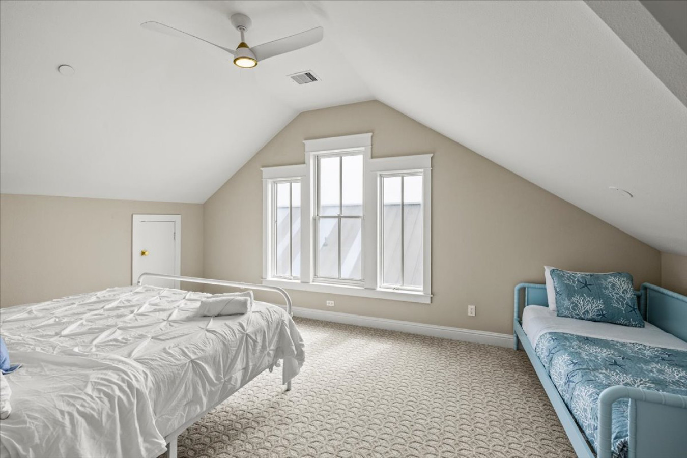 This bedroom has a king bed and a twin day bed