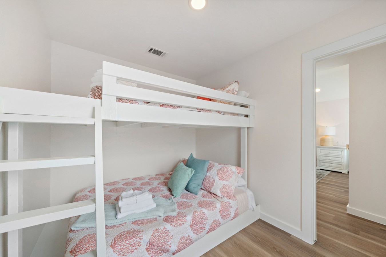 This bedroom has a full-over-queen bunk bed